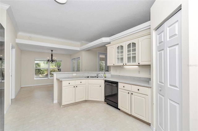 kitchen with a sink, light countertops, a peninsula, an inviting chandelier, and black dishwasher