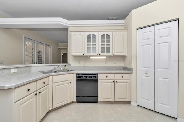 kitchen featuring a sink, light countertops, visible vents, and dishwasher