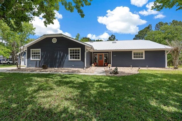 260 Country Circle Dr W, Port Orange, FL 32128 - ranch-style house with metal roof and a front yard