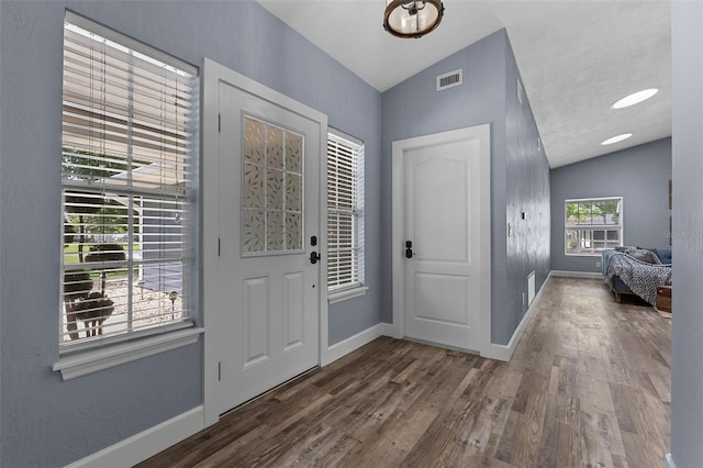 260 Country Circle Dr W, Port Orange, FL 32128 - entrance foyer with visible vents, baseboards, lofted ceiling, and dark wood-style floors