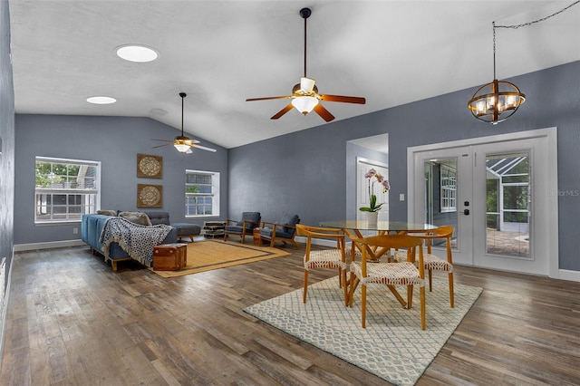 260 Country Circle Dr W, Port Orange, FL 32128 - dining space featuring french doors, wood finished floors, ceiling fan with notable chandelier, baseboards, and lofted ceiling