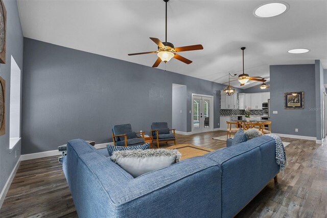 260 Country Circle Dr W, Port Orange, FL 32128 - living area with dark wood finished floors, vaulted ceiling, baseboards, and ceiling fan