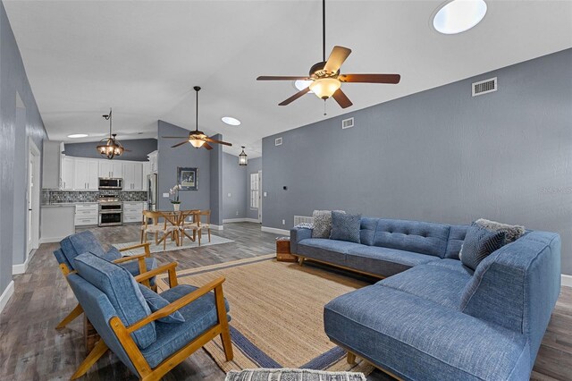 260 Country Circle Dr W, Port Orange, FL 32128 - living area featuring ceiling fan, baseboards, visible vents, and wood finished floors