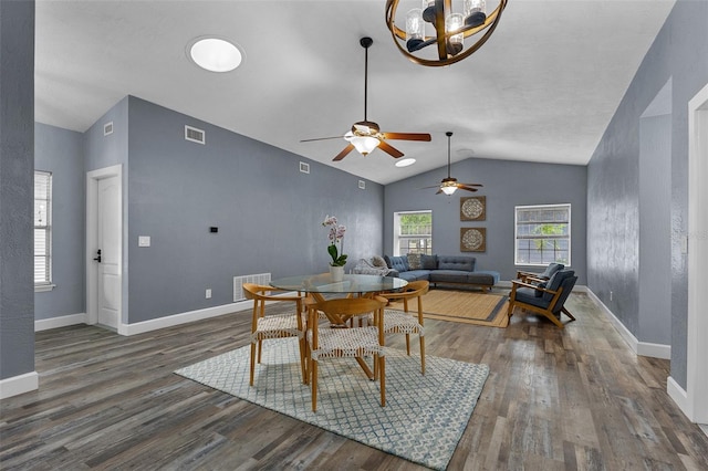 260 Country Circle Dr W, Port Orange, FL 32128 - dining room featuring visible vents, wood finished floors, lofted ceiling, and ceiling fan with notable chandelier