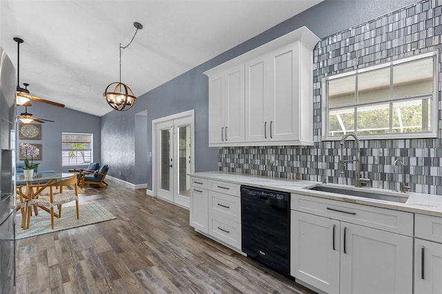 260 Country Circle Dr W, Port Orange, FL 32128 - kitchen featuring a sink, dishwasher, vaulted ceiling, decorative backsplash, and dark wood-style floors
