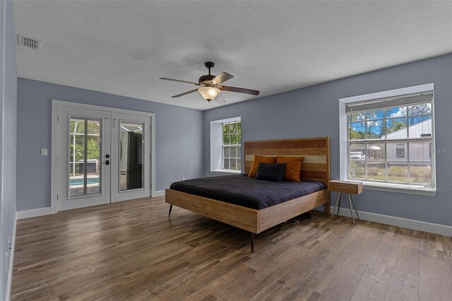 260 Country Circle Dr W, Port Orange, FL 32128 - bedroom with french doors, baseboards, visible vents, access to outside, and wood finished floors
