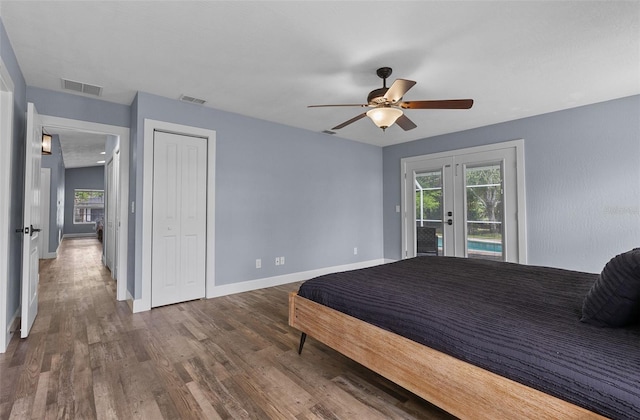 260 Country Circle Dr W, Port Orange, FL 32128 - bedroom with baseboards, access to outside, visible vents, and wood finished floors