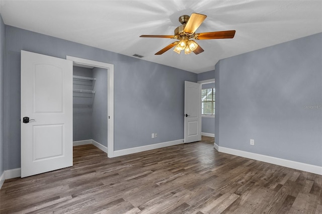 260 Country Circle Dr W, Port Orange, FL 32128 - unfurnished bedroom featuring baseboards, a closet, visible vents, and wood finished floors