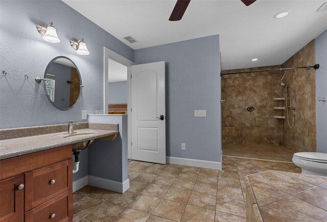 260 Country Circle Dr W, Port Orange, FL 32128 - full bathroom with visible vents, a tile shower, ceiling fan, and a sink