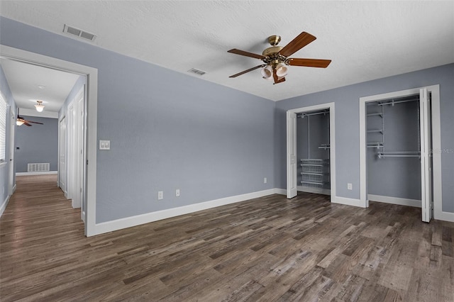 260 Country Circle Dr W, Port Orange, FL 32128 - unfurnished bedroom featuring baseboards, dark wood finished floors, and visible vents