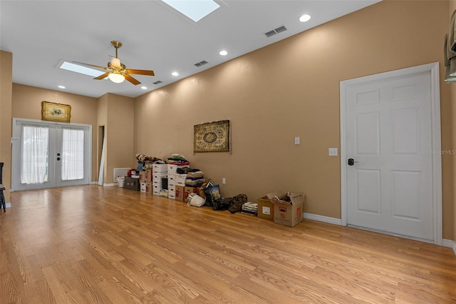 260 Country Circle Dr W, Port Orange, FL 32128 - misc room featuring a ceiling fan, light wood-style floors, visible vents, and a skylight