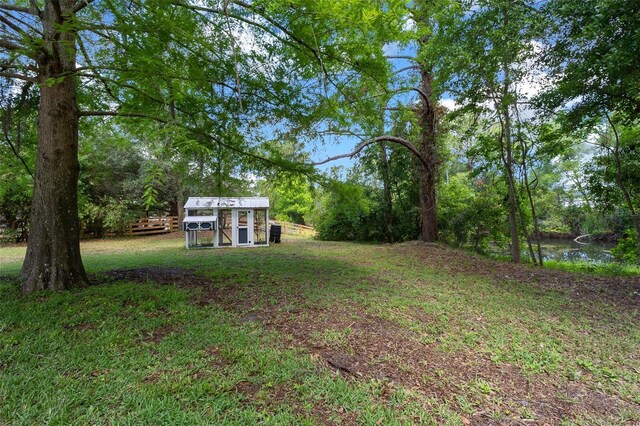 260 Country Circle Dr W, Port Orange, FL 32128 - view of yard featuring exterior structure and an outbuilding