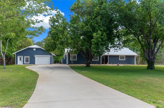 260 Country Circle Dr W, Port Orange, FL 32128 - ranch-style home with a detached garage, an outdoor structure, driveway, a front yard, and central AC unit