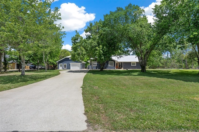 260 Country Circle Dr W, Port Orange, FL 32128 - ranch-style house featuring a front lawn, concrete driveway, and a detached garage