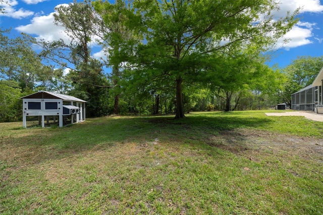 260 Country Circle Dr W, Port Orange, FL 32128 - view of yard featuring exterior structure and an outdoor structure