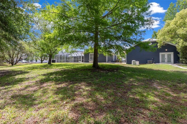 260 Country Circle Dr W, Port Orange, FL 32128 - view of yard with french doors and central AC