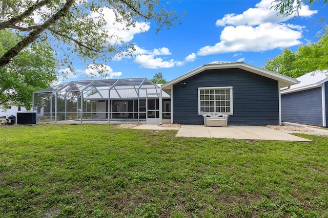 260 Country Circle Dr W, Port Orange, FL 32128 - rear view of property featuring a yard, a patio area, central AC, and a lanai