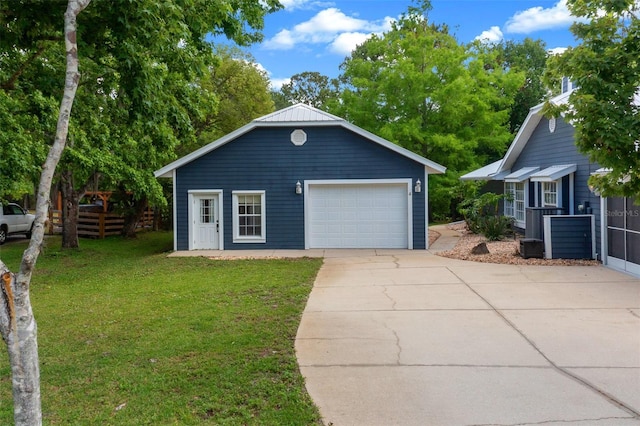 260 Country Circle Dr W, Port Orange, FL 32128 - view of front of house featuring an outdoor structure, a detached garage, a front lawn, and driveway