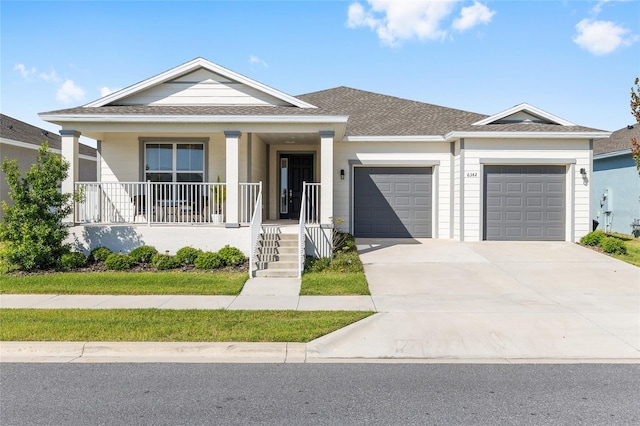 6342 SW 77th Ave, Ocala, FL 34474 - view of front facade featuring driveway, a porch, a shingled roof, and an attached garage