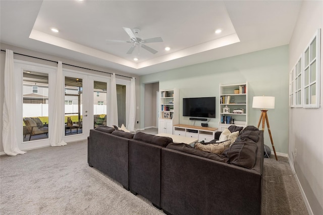 6342 SW 77th Ave, Ocala, FL 34474 - living room with carpet, french doors, a tray ceiling, ceiling fan, and recessed lighting