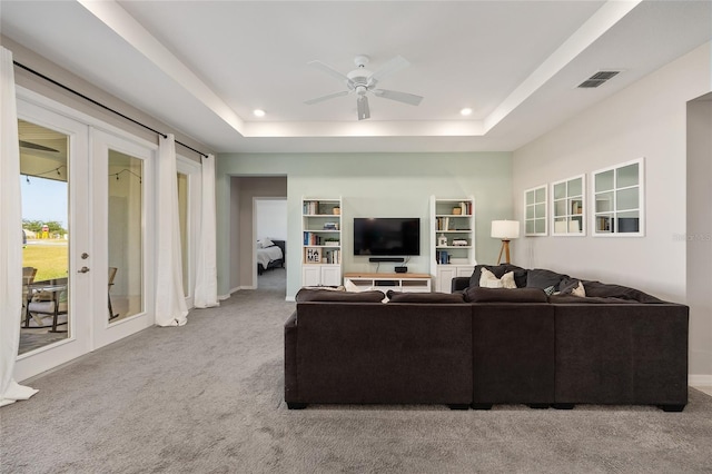 6342 SW 77th Ave, Ocala, FL 34474 - carpeted living area with a tray ceiling, ceiling fan, french doors, and visible vents