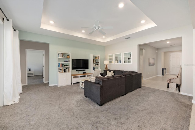 6342 SW 77th Ave, Ocala, FL 34474 - living area featuring a tray ceiling, light colored carpet, ceiling fan, and recessed lighting