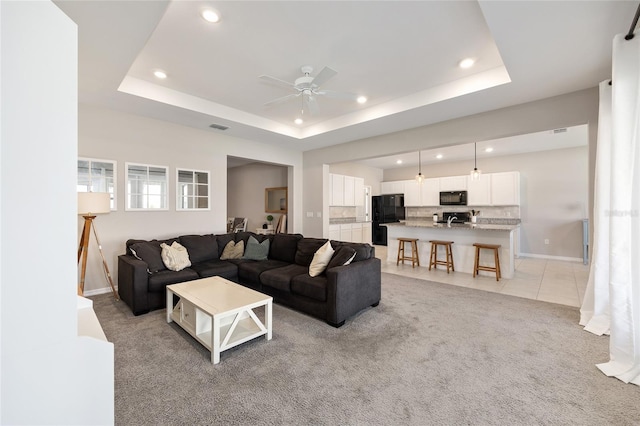 6342 SW 77th Ave, Ocala, FL 34474 - living area with a ceiling fan, a raised ceiling, and recessed lighting