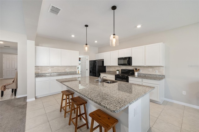 6342 SW 77th Ave, Ocala, FL 34474 - kitchen with light tile patterned flooring, visible vents, a sink, backsplash, and black appliances