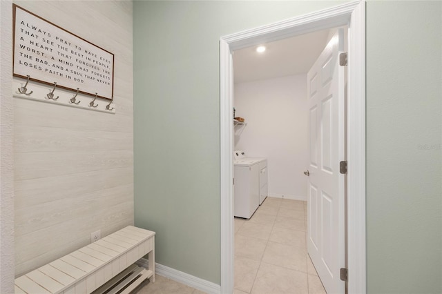 6342 SW 77th Ave, Ocala, FL 34474 - mudroom with light tile patterned floors, baseboards, and washer and dryer