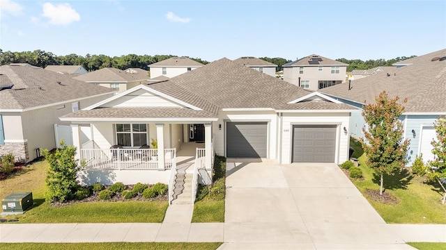 6342 SW 77th Ave, Ocala, FL 34474 - view of front facade featuring covered porch, roof with shingles, a residential view, driveway, and a garage