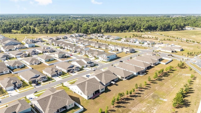 6342 SW 77th Ave, Ocala, FL 34474 - drone / aerial view with a view of trees and a residential view