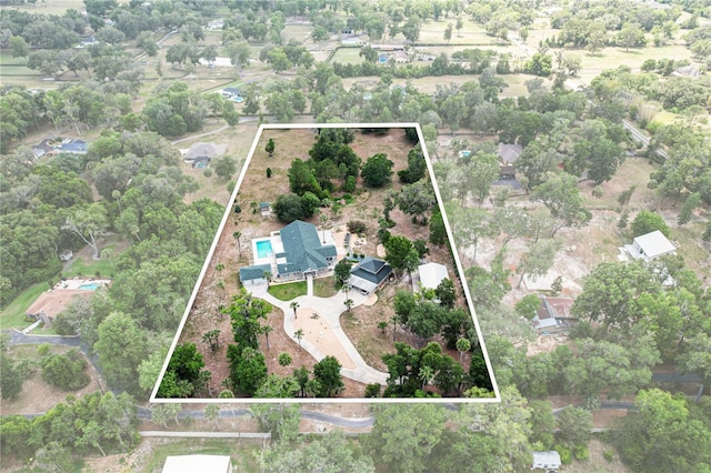 170 SW 80th St, Ocala, FL 34476 - aerial view of property and surrounding area with property boundaries highlighted and a tree filled landscape