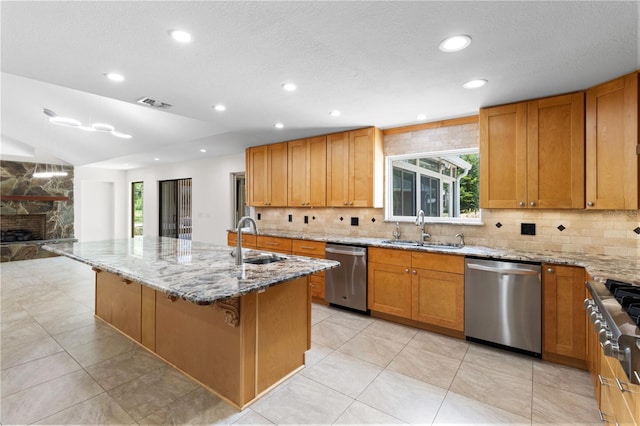 170 SW 80th St, Ocala, FL 34476 - kitchen with stainless steel appliances, a sink, decorative backsplash, light stone countertops, and recessed lighting