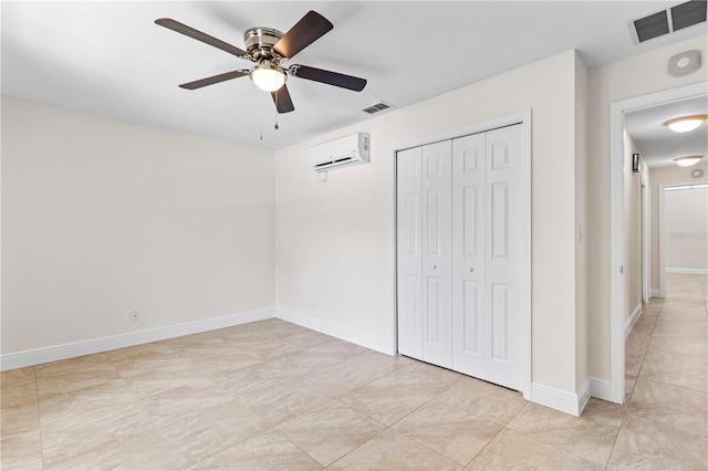 170 SW 80th St, Ocala, FL 34476 - unfurnished bedroom with a wall unit AC, a closet, a ceiling fan, and baseboards