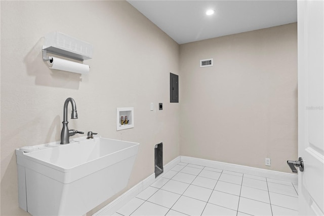 170 SW 80th St, Ocala, FL 34476 - laundry room featuring hookup for an electric dryer, washer hookup, electric panel, baseboards, and light tile patterned floors