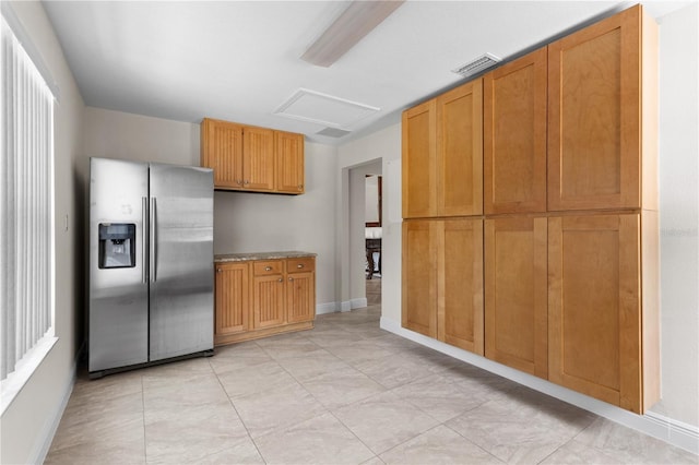 170 SW 80th St, Ocala, FL 34476 - kitchen with stainless steel fridge, baseboards, and light tile patterned floors
