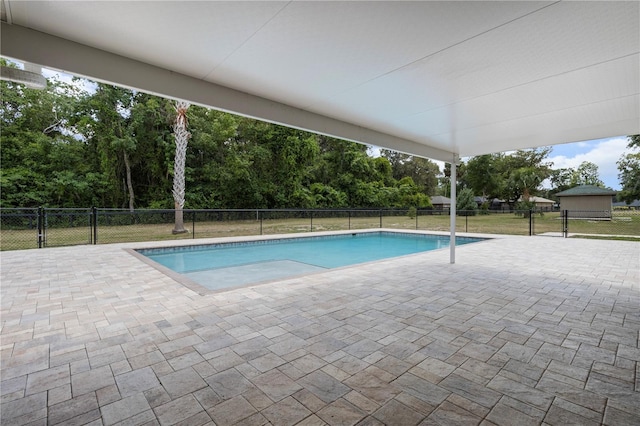 170 SW 80th St, Ocala, FL 34476 - view of swimming pool featuring a patio area and view of wooded area