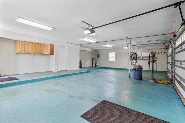 170 SW 80th St, Ocala, FL 34476 - garage with a garage door opener and baseboards