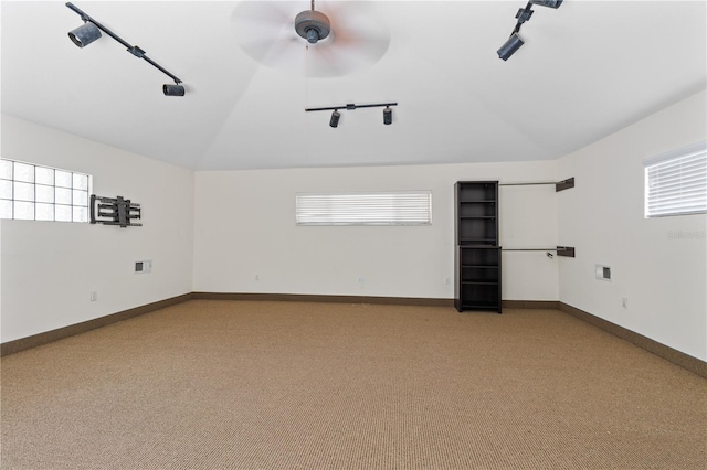 170 SW 80th St, Ocala, FL 34476 - unfurnished room featuring rail lighting, lofted ceiling, light colored carpet, a ceiling fan, and plenty of natural light