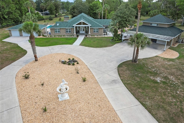 170 SW 80th St, Ocala, FL 34476 - view of front of property with concrete driveway, a front lawn, and view of wooded area