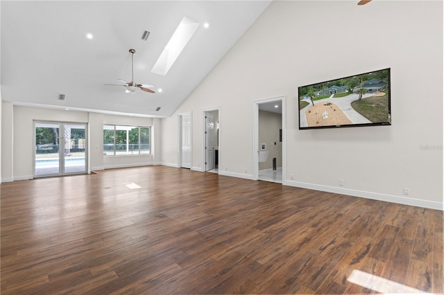 170 SW 80th St, Ocala, FL 34476 - unfurnished living room with ceiling fan, high vaulted ceiling, wood finished floors, a skylight, and baseboards