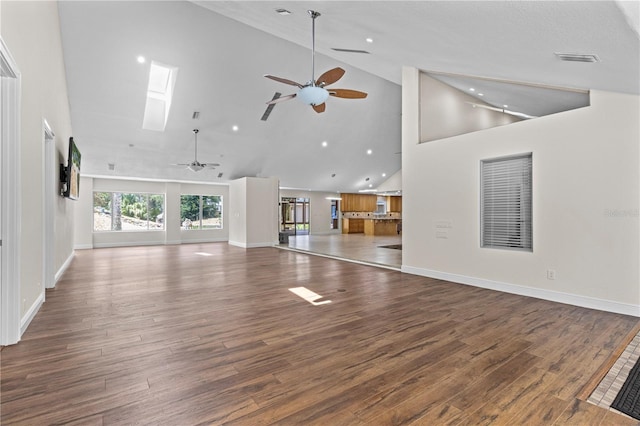 170 SW 80th St, Ocala, FL 34476 - unfurnished living room with a ceiling fan, wood finished floors, high vaulted ceiling, baseboards, and recessed lighting