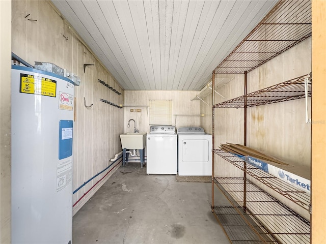 6263 SW 107th St, Ocala, FL 34476 - clothes washing area with washer and dryer, a sink, wood walls, electric water heater, and laundry area