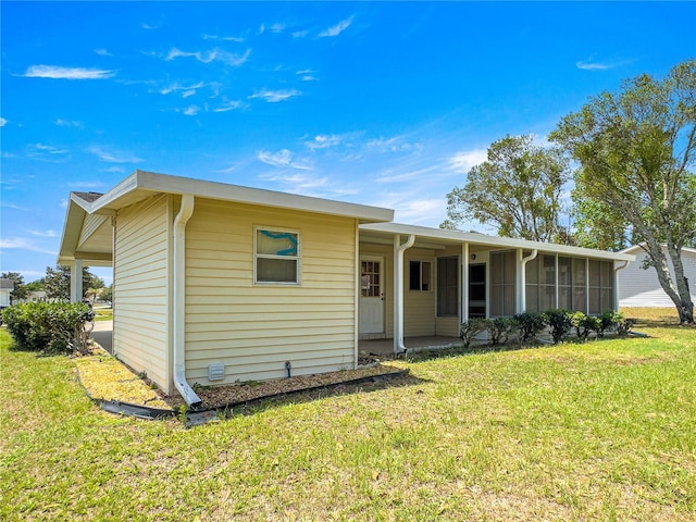 6263 SW 107th St, Ocala, FL 34476 - ranch-style home with a sunroom and a front yard
