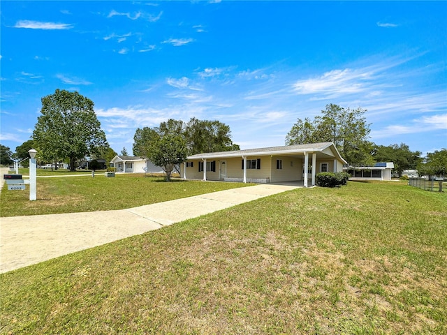 6263 SW 107th St, Ocala, FL 34476 - view of front of home featuring driveway, a front yard, and an attached carport