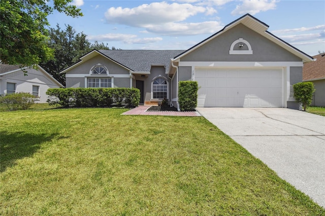 1317 Ravida Woods Dr, Apopka, FL 32703 - single story home featuring stucco siding, driveway, an attached garage, and a front lawn