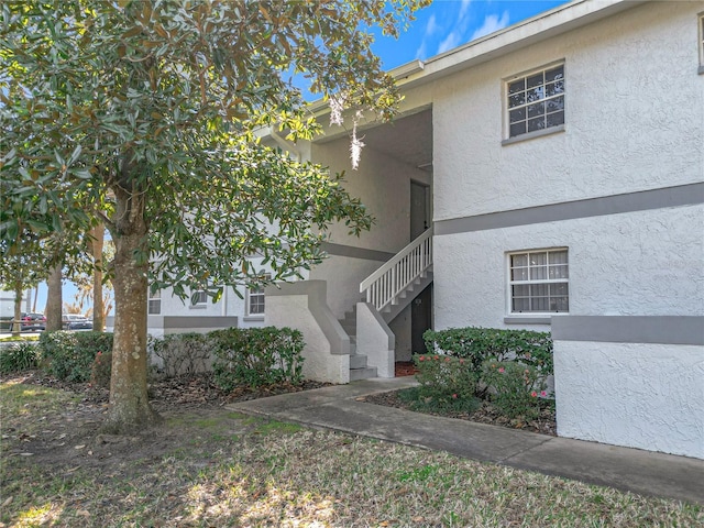 view of property with stairway