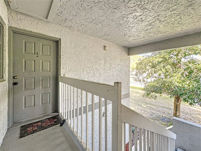 view of exterior entry with stucco siding