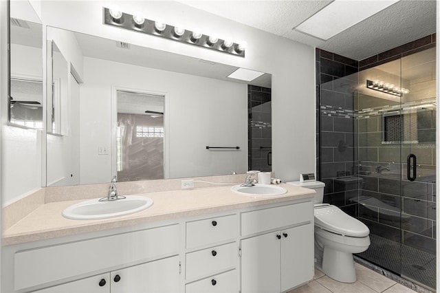 6758 SW 114th Street Rd, Ocala, FL 34476 - bathroom featuring double vanity, toilet, a sink, tile patterned flooring, and a shower stall
