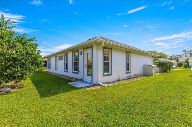 6758 SW 114th Street Rd, Ocala, FL 34476 - back of property with a yard and stucco siding